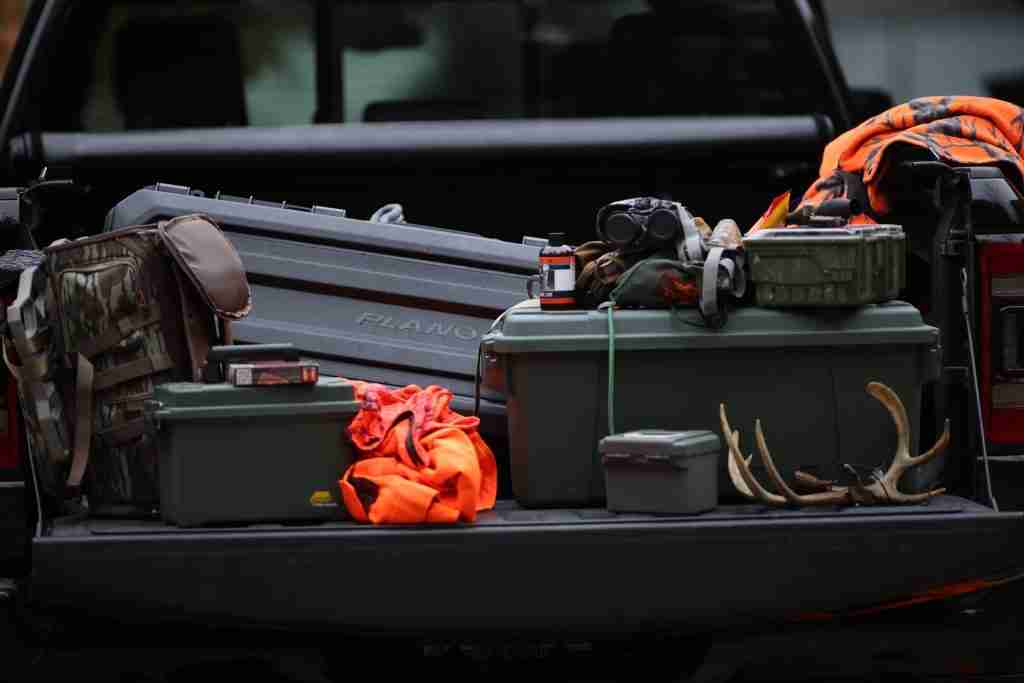 All-weather gun case inside of a truck bed for hunting and outdoor sports. 
